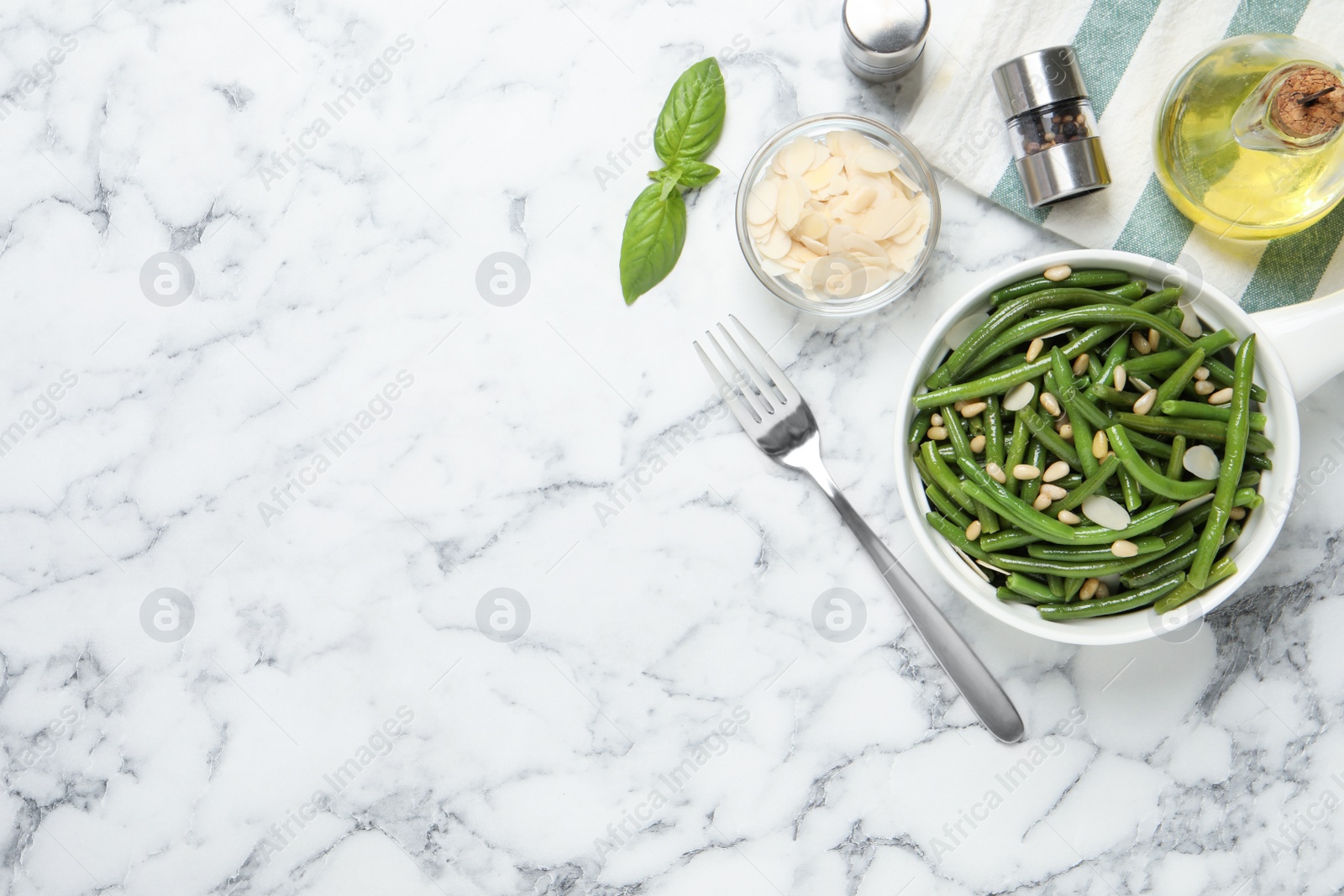 Photo of Tasty salad with green beans served on white marble table, flat lay. Space for text