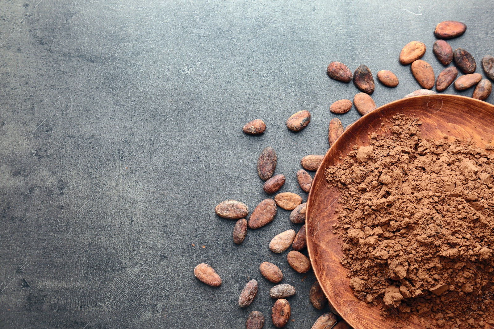 Photo of Flat lay composition with cocoa powder and beans on grey background