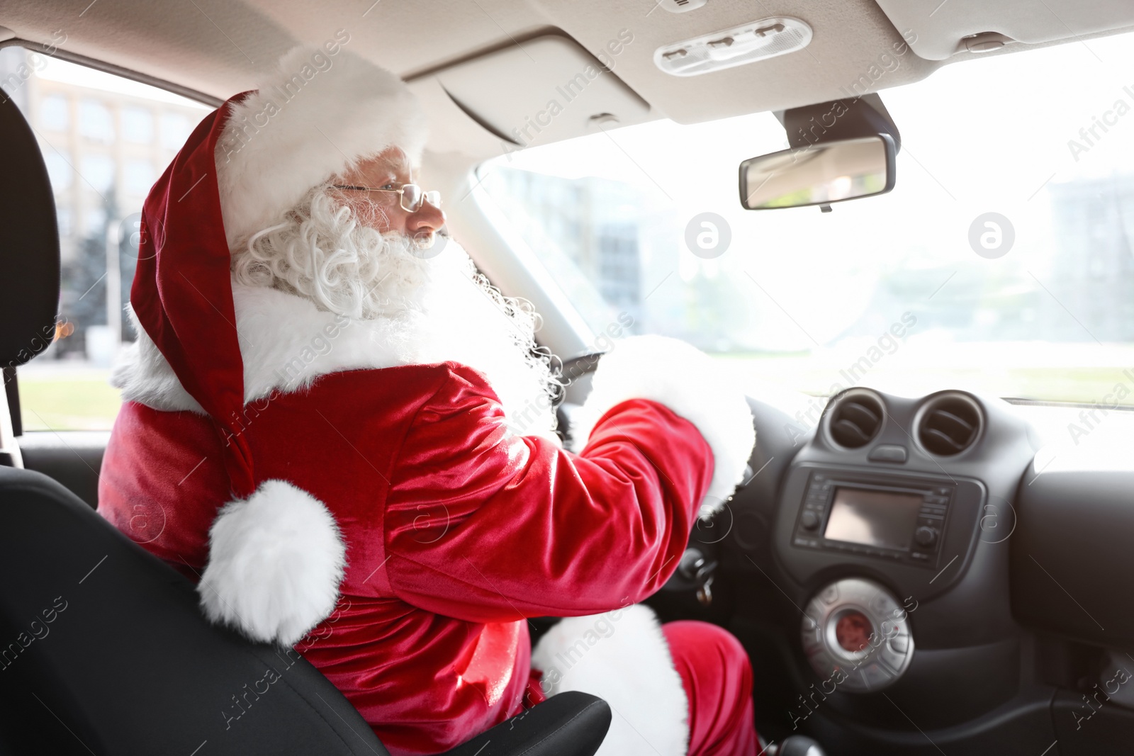Photo of Authentic Santa Claus driving car, view from inside
