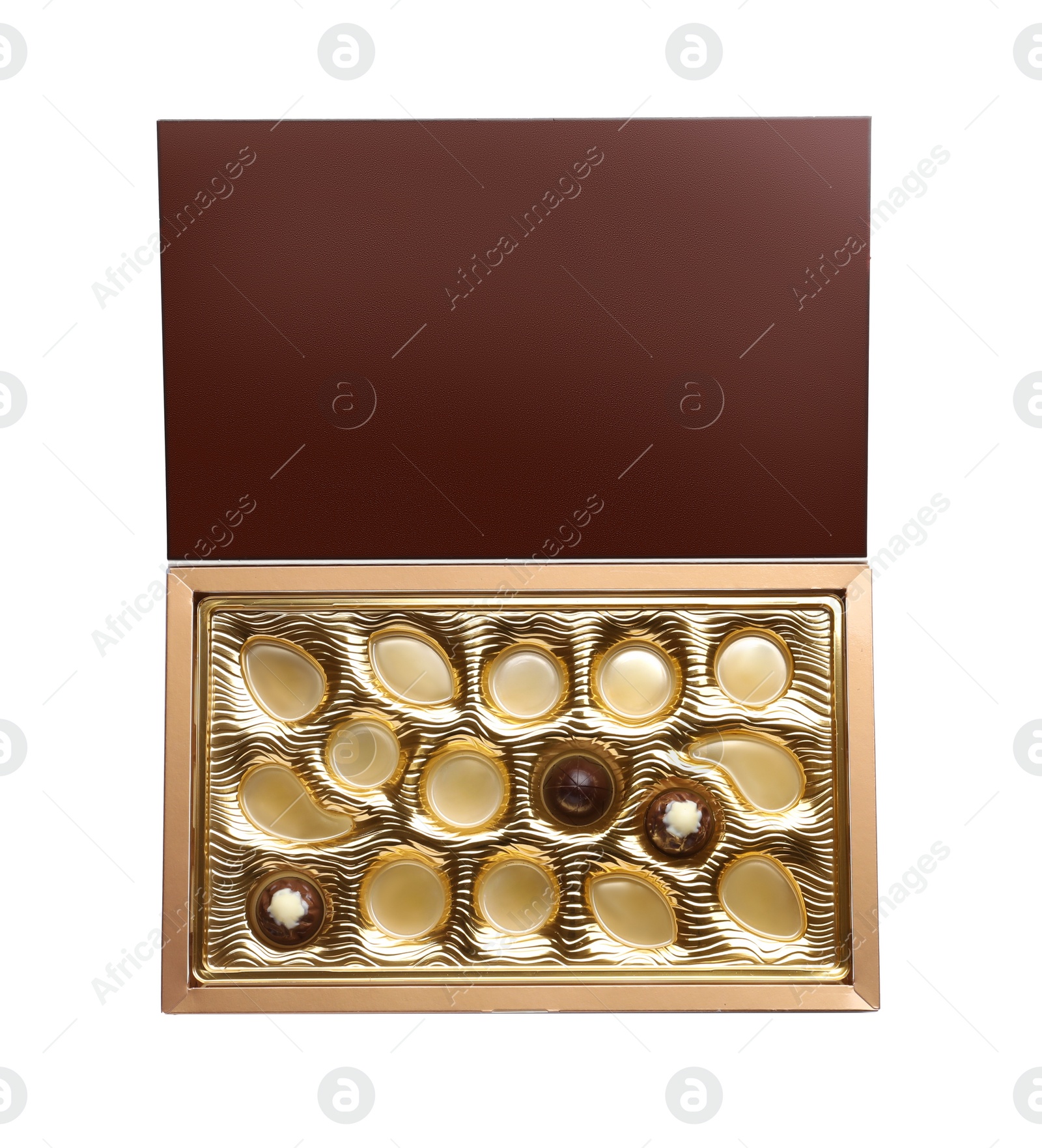 Photo of Partially empty box of chocolate candies isolated on white, top view