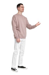 Photo of Full length portrait of handsome young man on white background