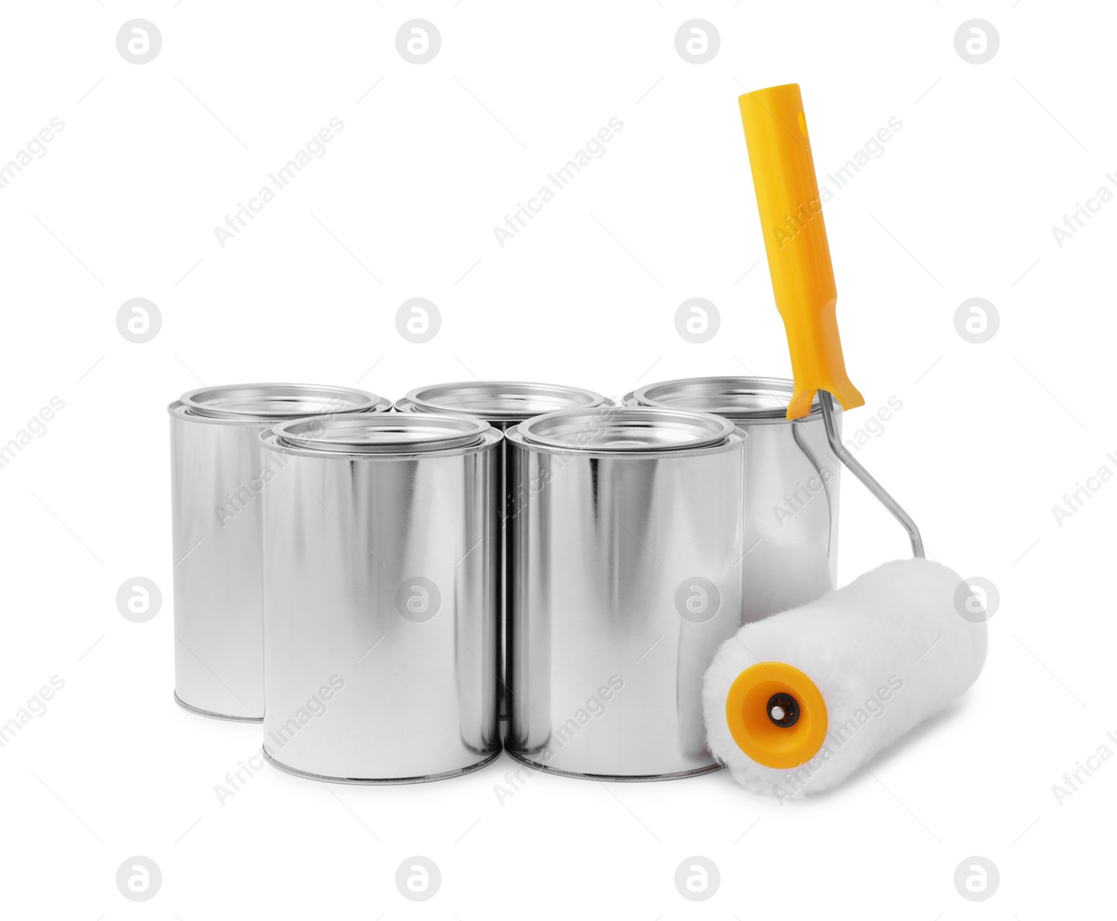 Photo of Cans of paints and roller on white background