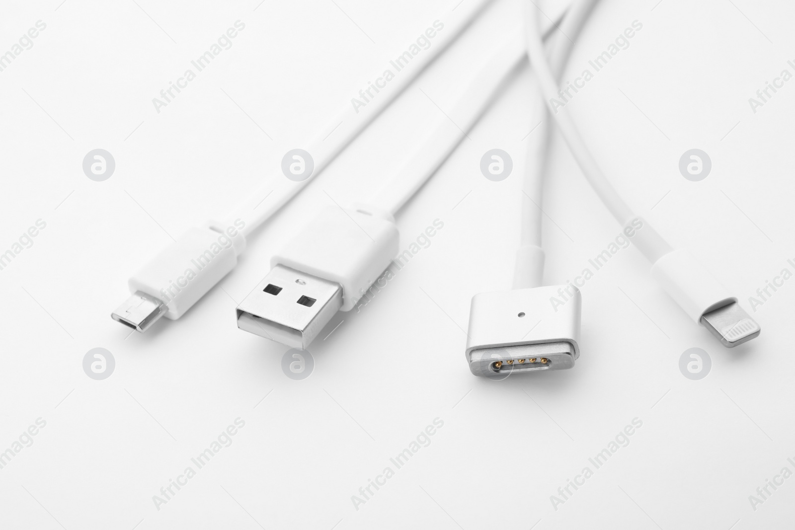 Photo of Charge cables on white background. Modern technology