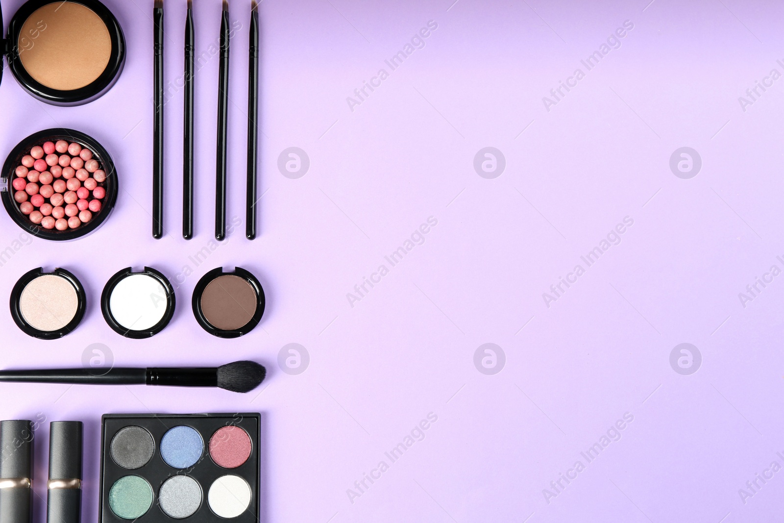 Photo of Flat lay composition with makeup brushes on violet background, space for text