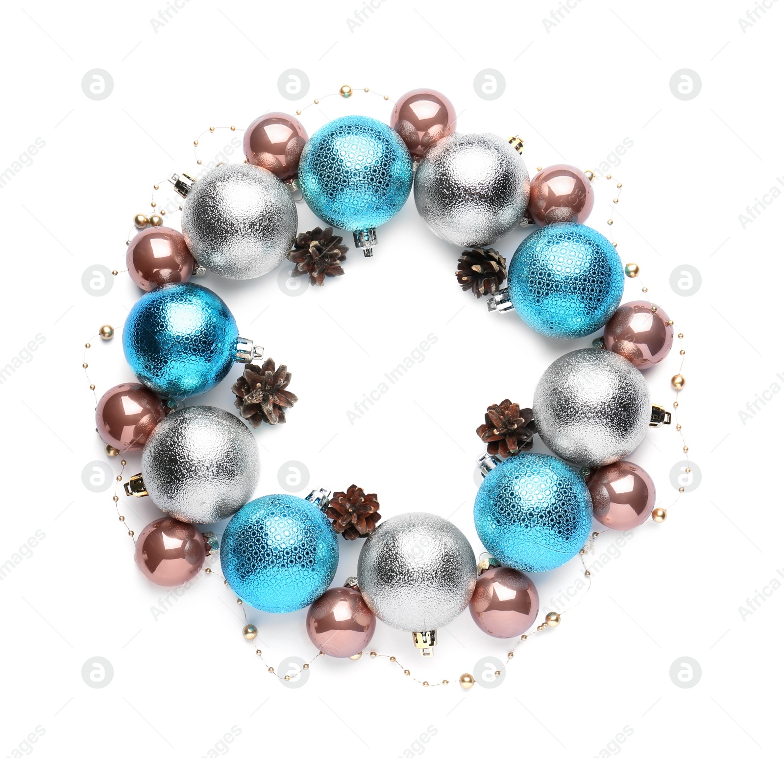 Photo of Beautiful Christmas wreath made of shiny baubles, garland and pine cones on white background, top view