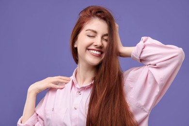 Photo of Portrait of smiling woman on purple background