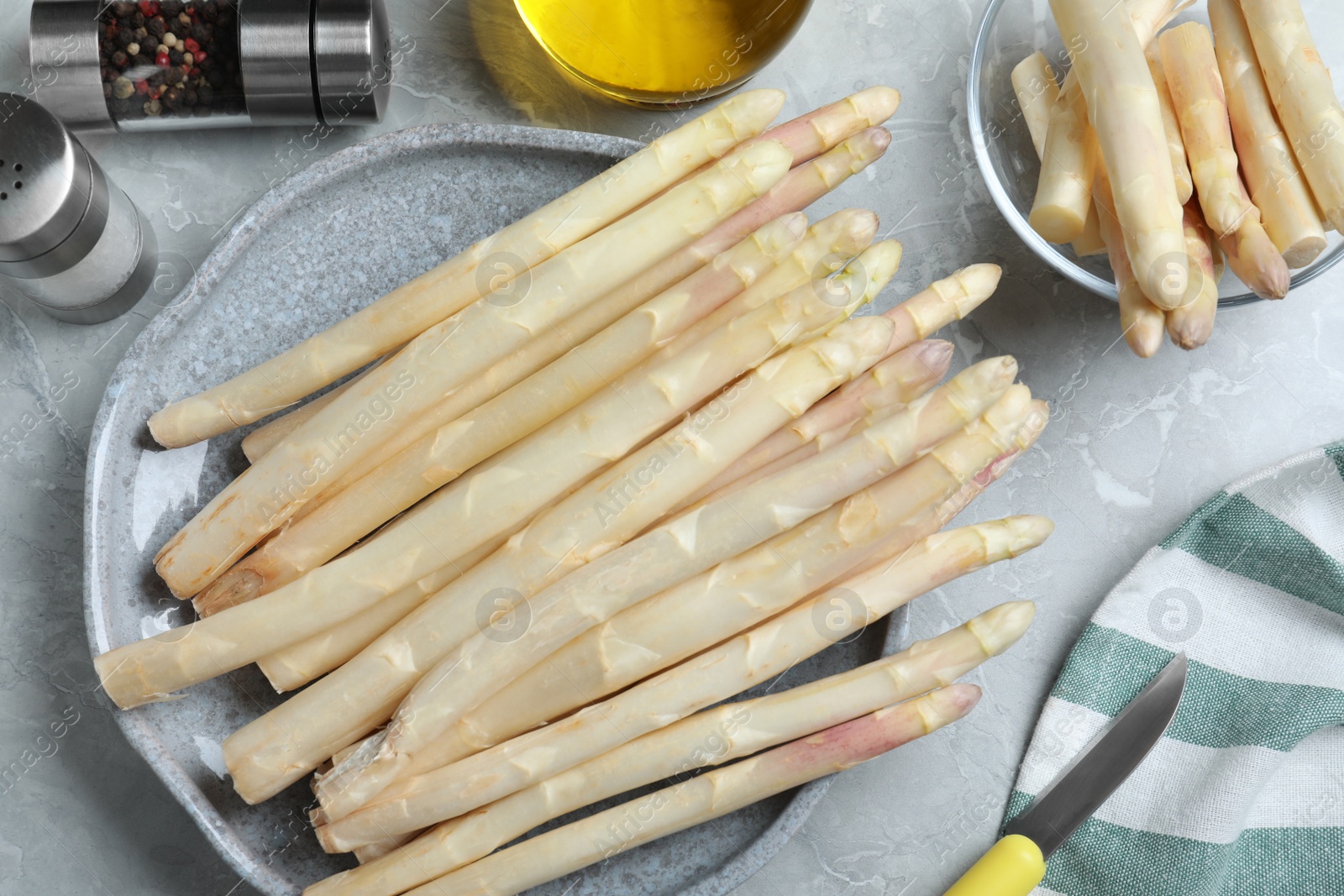 Photo of Flat lay composition with white asparagus on grey marble table