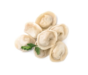 Pile of boiled dumplings with parsley leaves on white background, top view