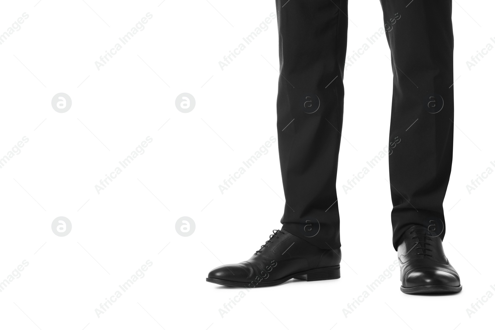 Photo of Businessman in leather shoes on white background, closeup