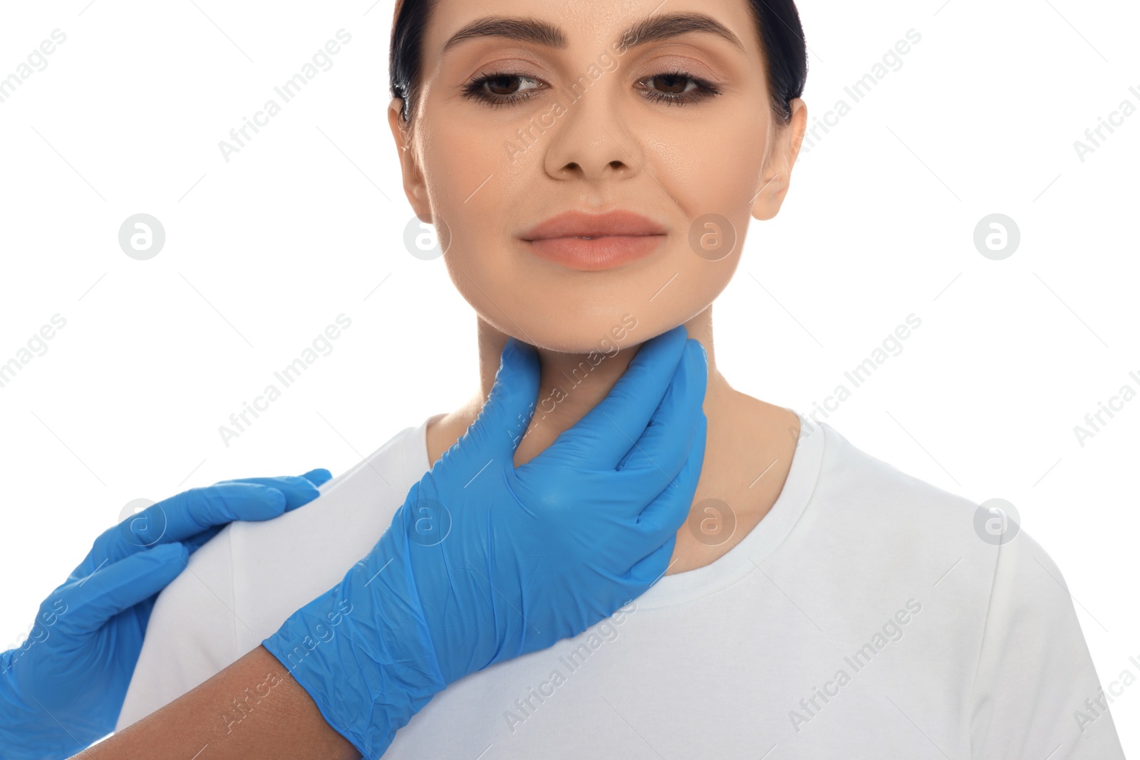 Photo of Endocrinologist examining thyroid gland of patient on white background, closeup