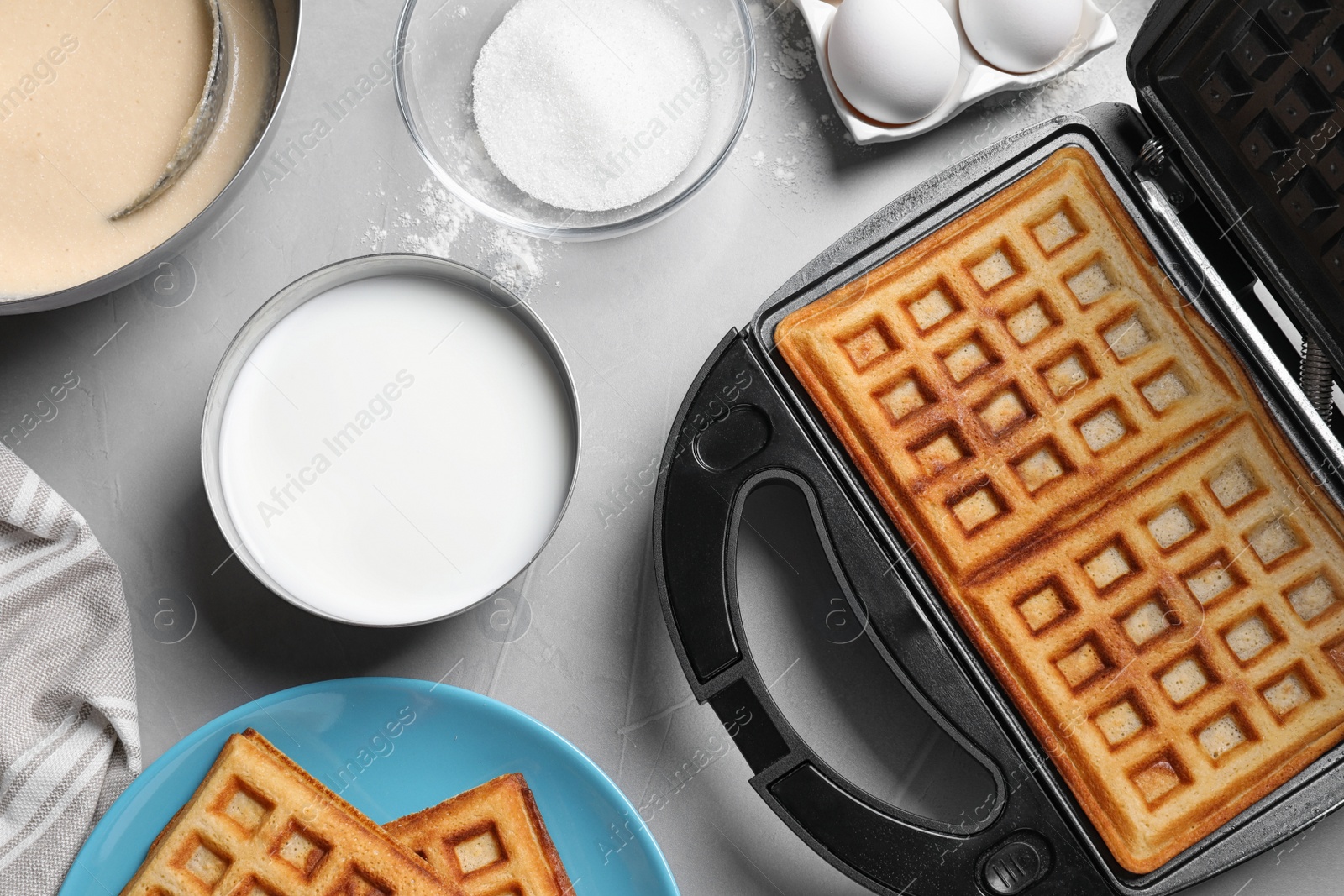 Photo of Flat lay composition with fresh Belgian waffles on light grey table