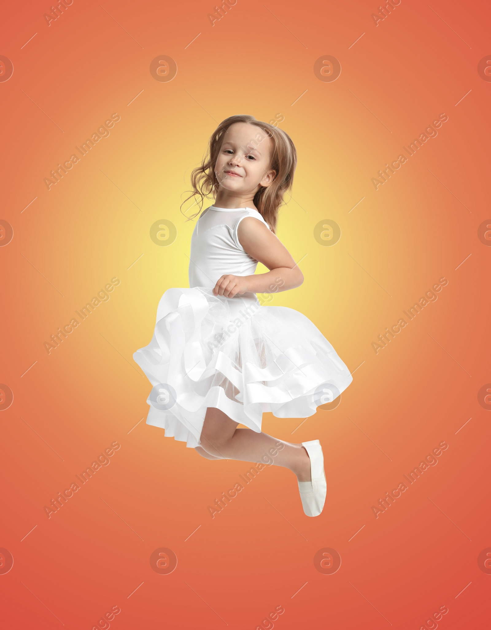 Image of Happy cute girl jumping on color gradient background