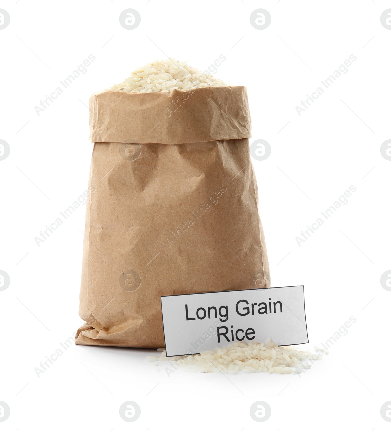 Photo of Paper bag with uncooked long grain rice and card on white background