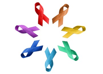Image of Set with different color ribbons on white background, top view. World Cancer Day