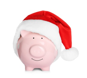 Cute piggy bank with Santa hat on white background