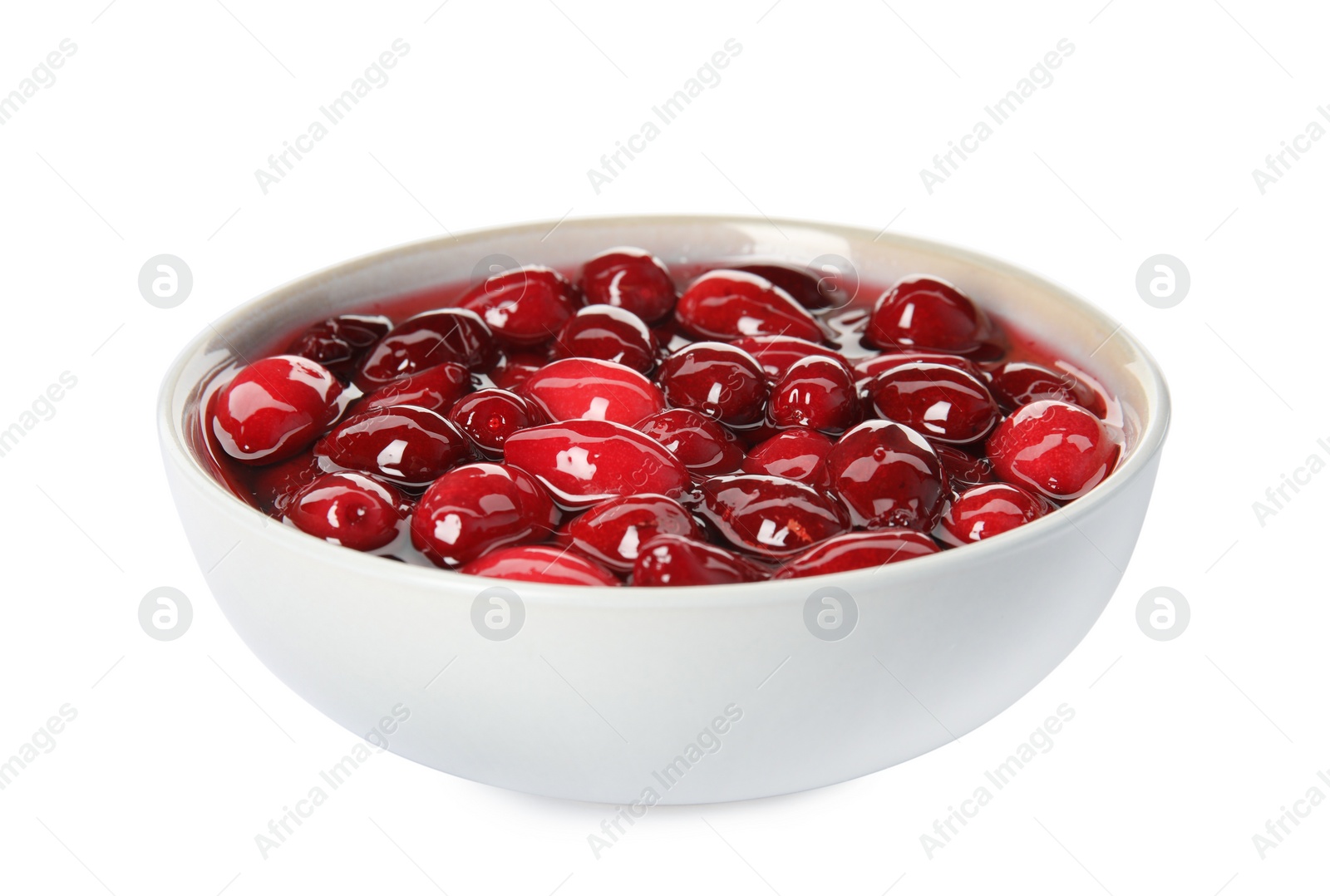 Photo of Delicious dogwood jam with berries in bowl isolated on white