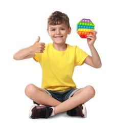 Photo of Boy with pop it fidget toy on white background