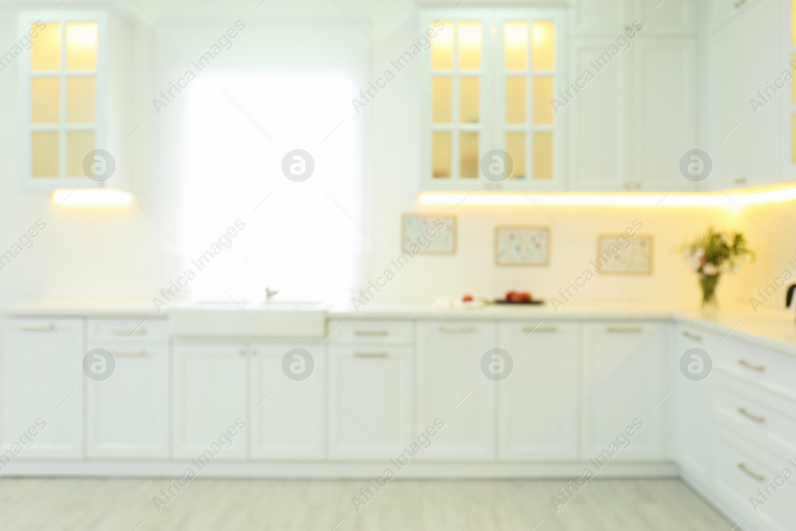 Photo of Blurred view of modern kitchen interior with stylish furniture