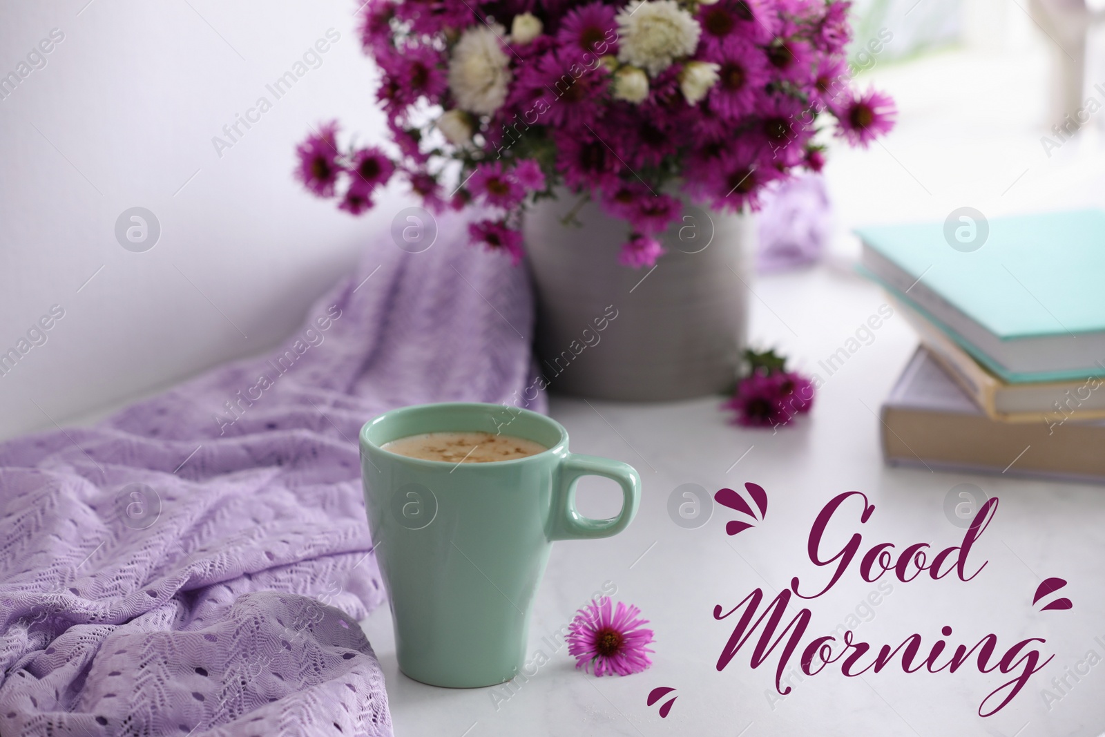 Image of Good morning! Cup of aromatic coffee, beautiful flowers and violet cloth on white table