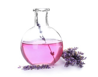 Photo of Flask with aromatic lavender oil on white background