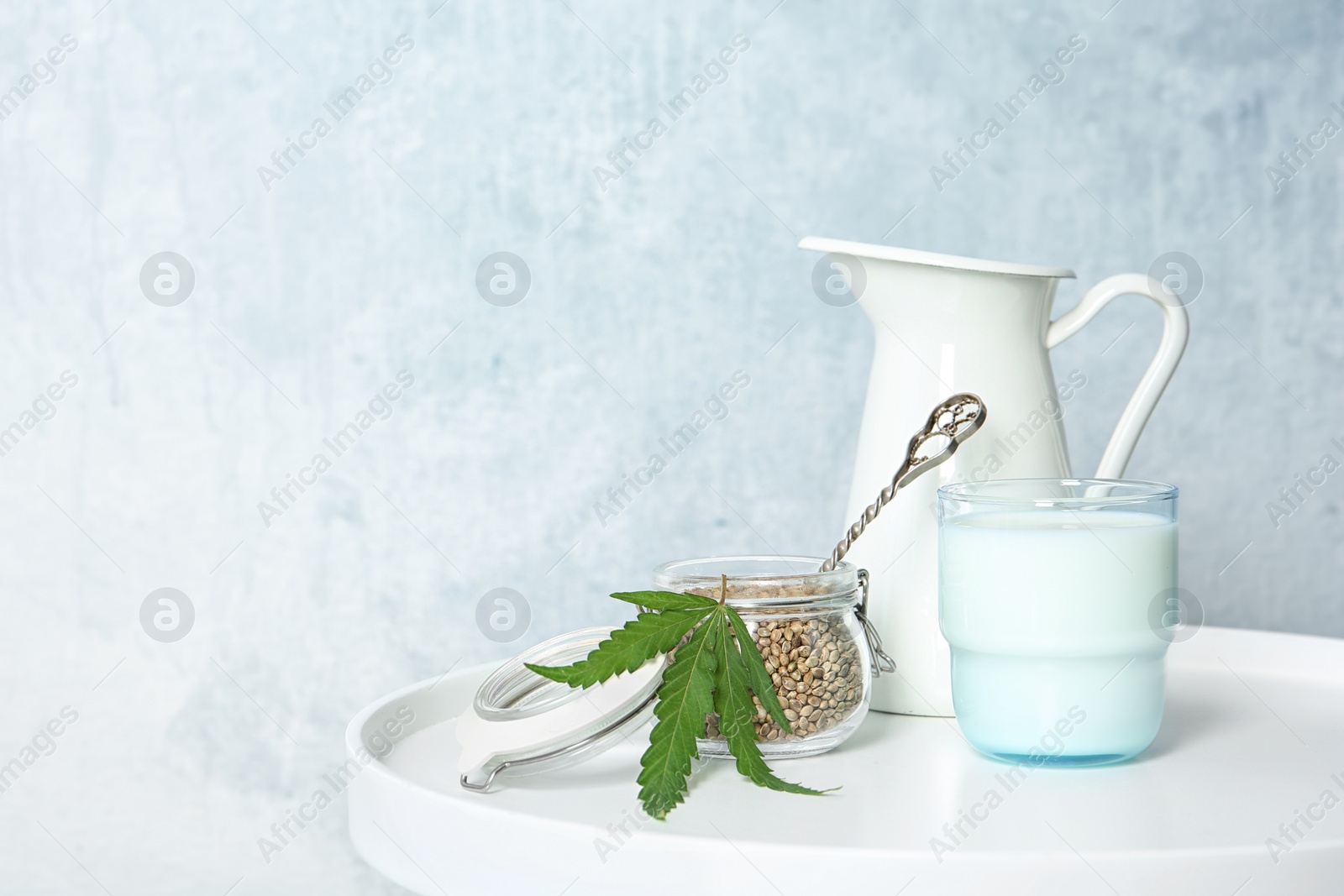 Photo of Composition with hemp milk on white table