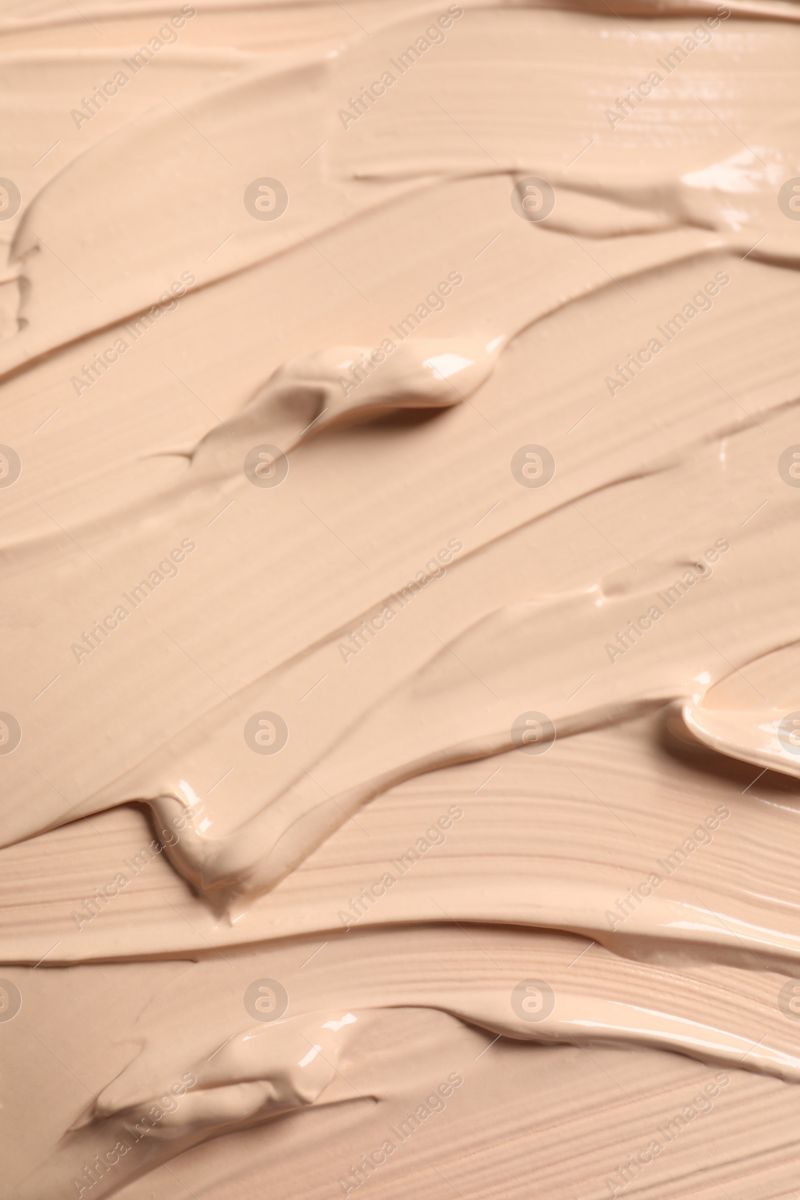 Photo of Texture of skin foundation as background, closeup