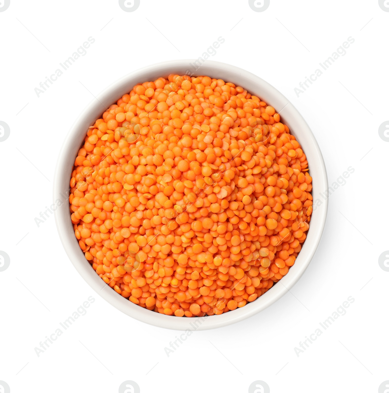 Photo of Raw red lentils in bowl isolated on white, top view