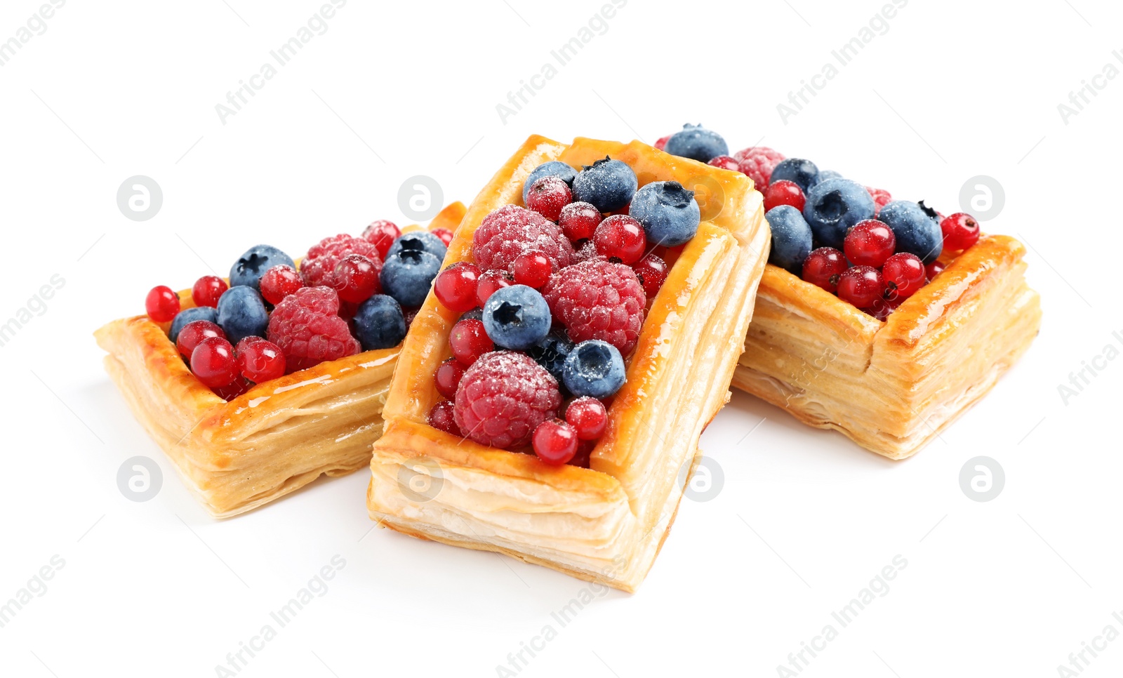 Photo of Fresh delicious puff pastry with sweet berries on white background