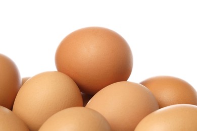 Photo of Many brown chicken eggs isolated on white