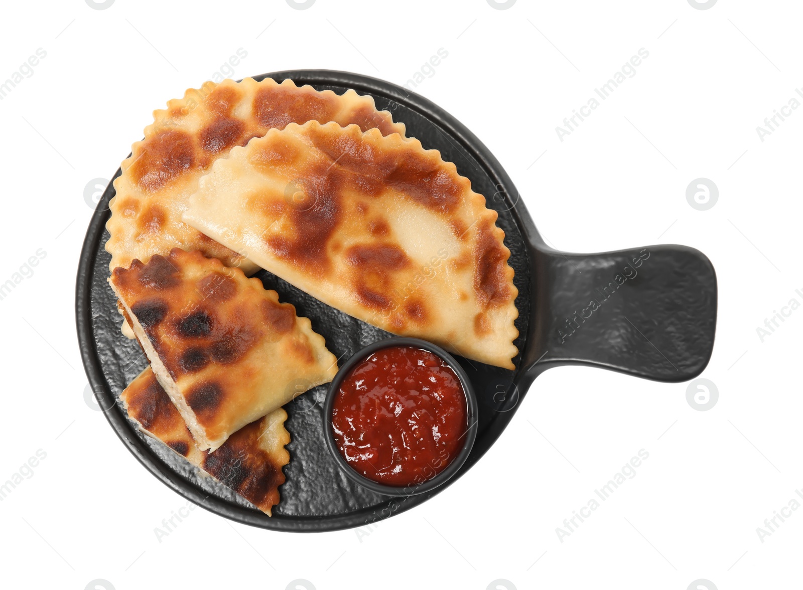 Photo of Delicious fried chebureki with ketchup isolated on white, top view