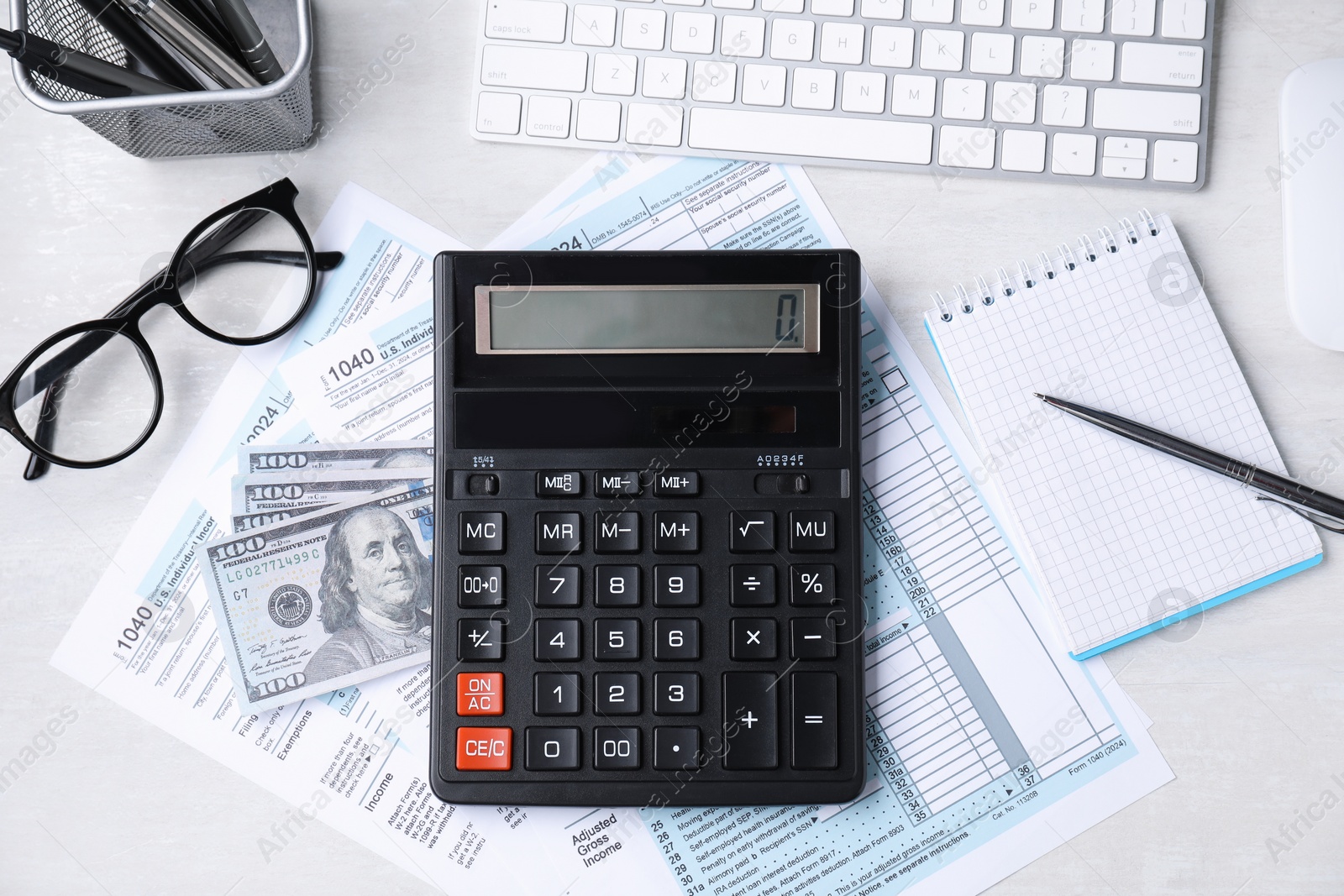 Photo of Tax accounting. Flat lay composition with calculator and documents on light grey table