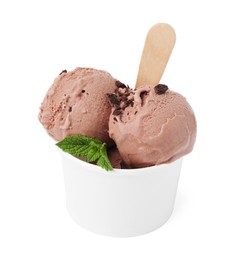 Photo of Paper cup with tasty chocolate ice cream, sticks and mint leaves isolated on white