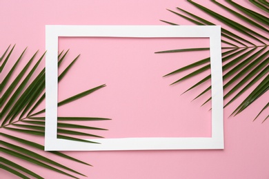 Photo of Beautiful composition with tropical leaves on color background, top view