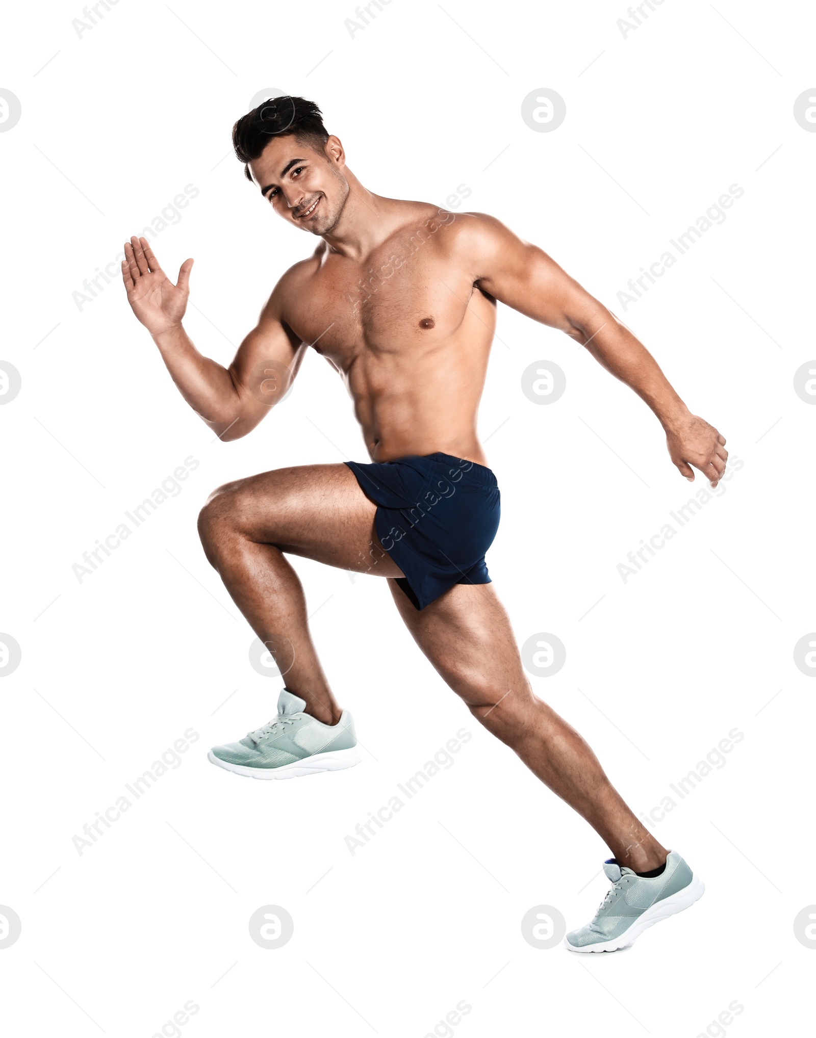 Photo of Handsome young man running on white background