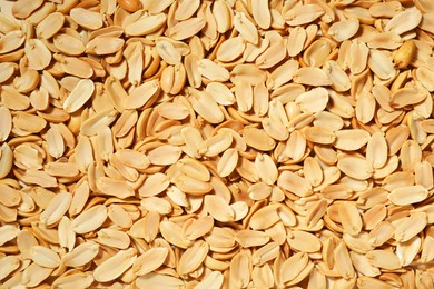 Fresh peeled peanuts as background, top view