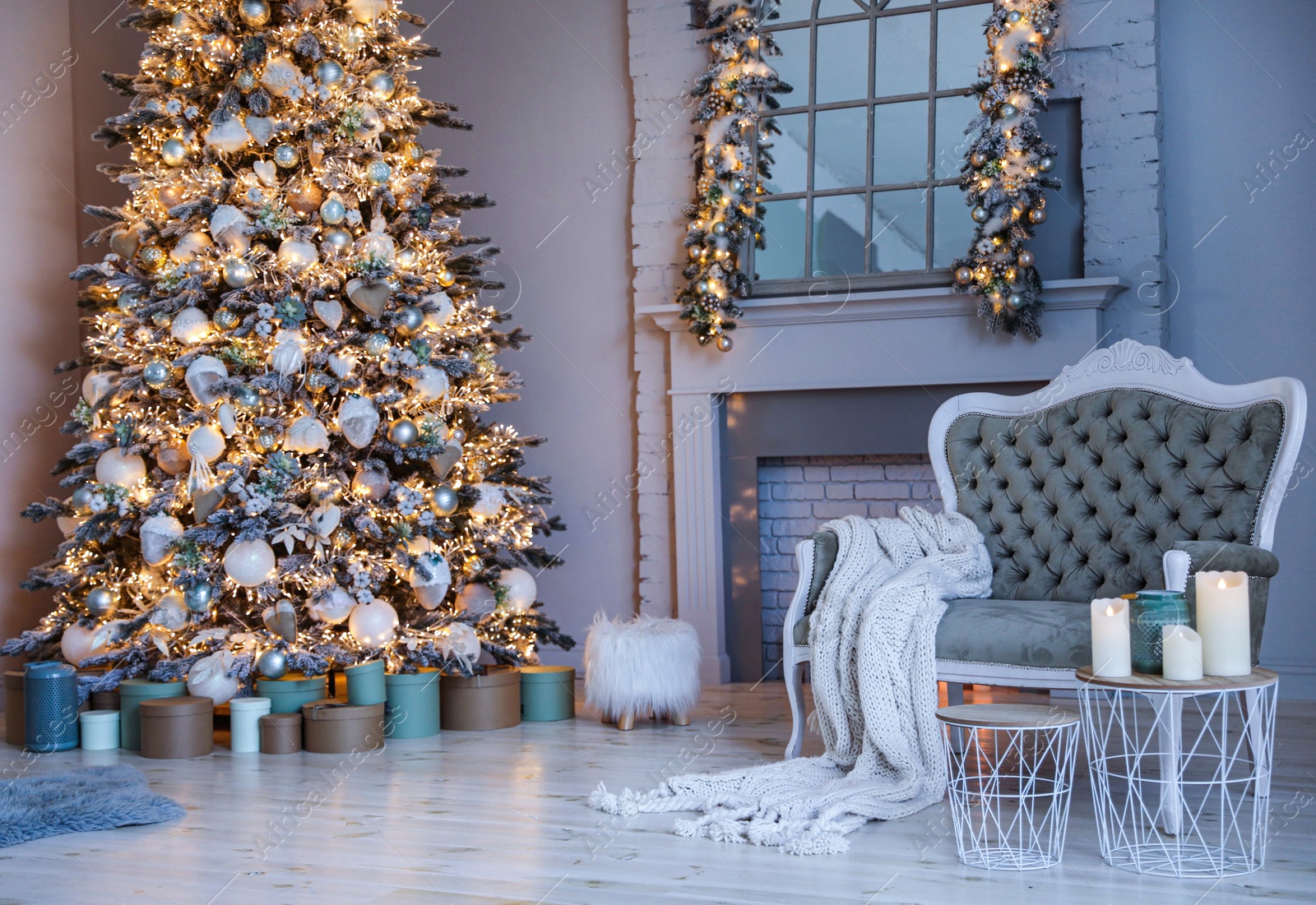 Photo of Festive room interior with stylish furniture and beautiful Christmas tree