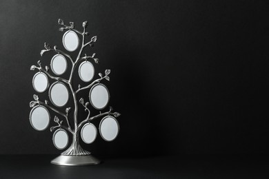 Photo of Blank metal family tree frame on black background. Space for text
