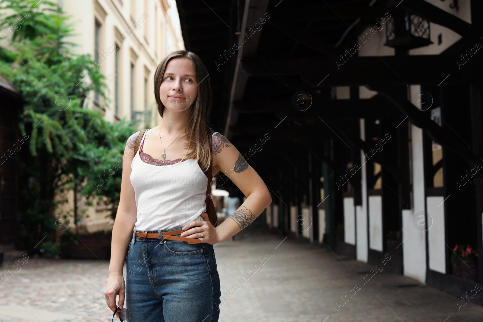 Photo of Portrait of young woman on city street