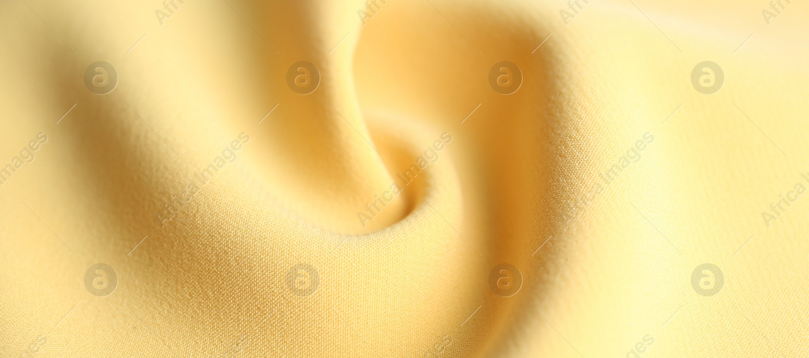 Photo of Texture of beautiful yellow fabric as background, closeup