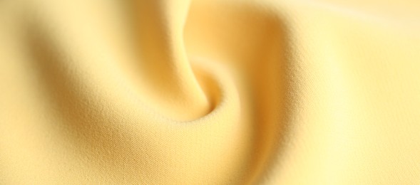 Photo of Texture of beautiful yellow fabric as background, closeup