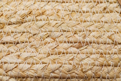 Photo of Elegant woman's straw bag as background, closeup