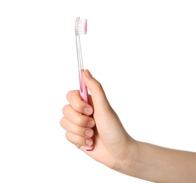 Photo of Woman holding manual toothbrush against white background