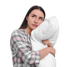 Photo of Tired young woman with pillow on white background. Insomnia problem