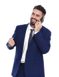 Photo of Happy young businessman with smartphone celebrating victory on white background