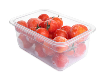 Photo of Frozen tomatoes in plastic container isolated on white. Vegetable preservation