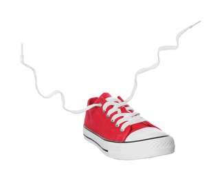 Photo of Red classic old school sneaker isolated on white