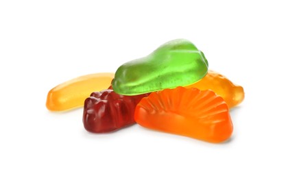 Tasty jelly fruit shaped candies on white background