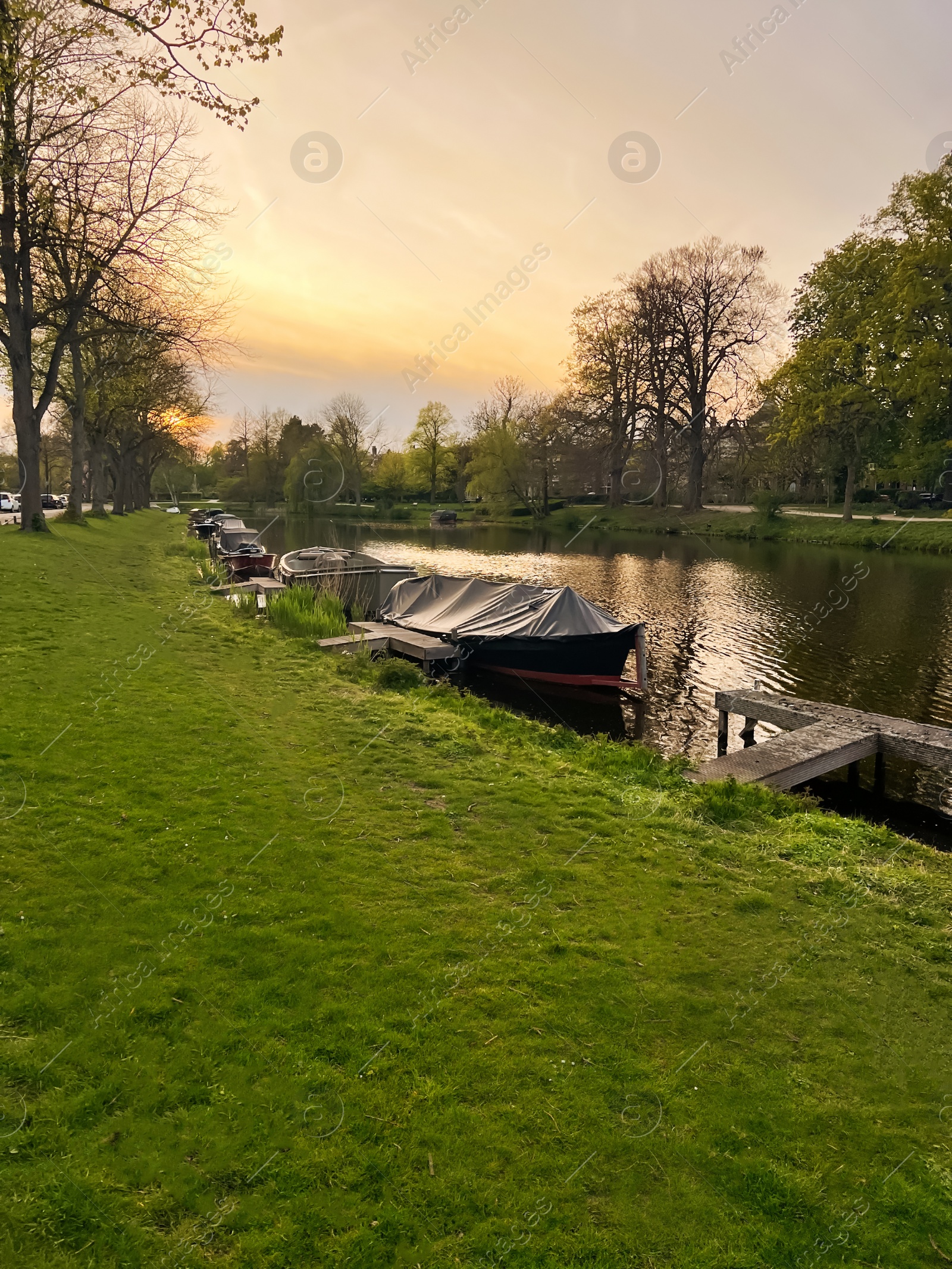 Photo of Beautiful view of canal with boats in evening