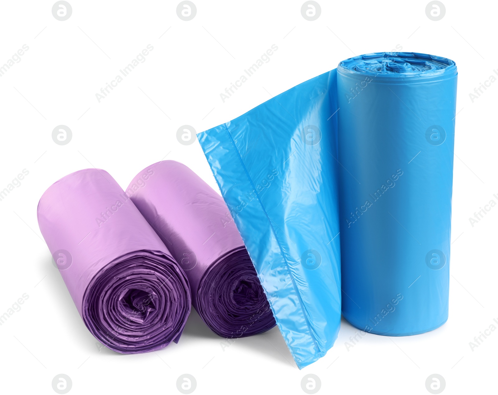 Photo of Rolls of different garbage bags on white background. Cleaning supplies