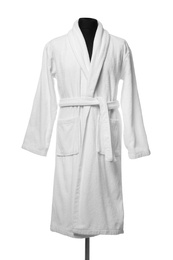 Photo of New comfortable bathrobe on mannequin against white background